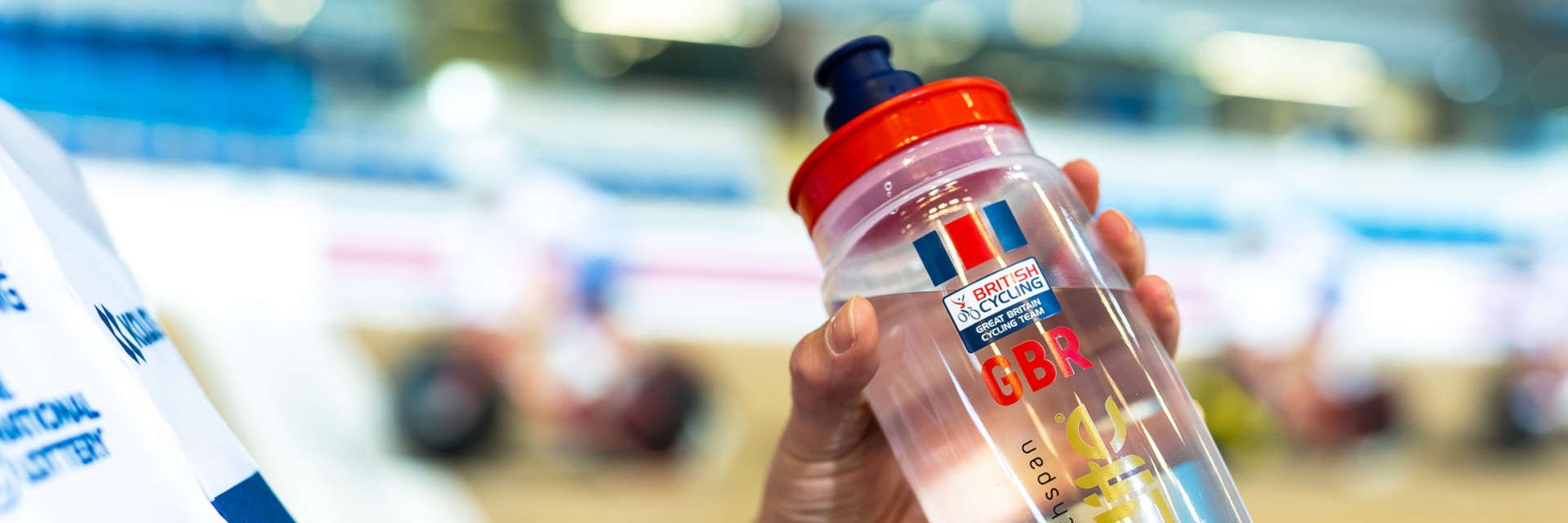 British Cycling athlete drinking from a water bottle