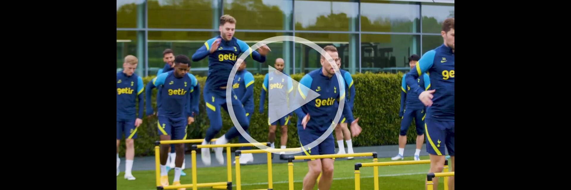 Tottenham Hotspur players jumping hurdles in training
