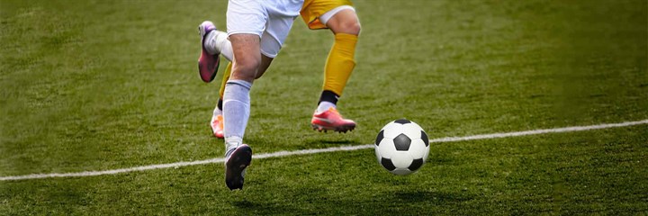 Two people playing football