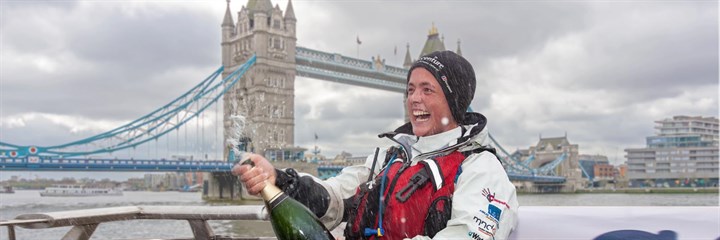 Sarah Outen with Champagne popping in celebration