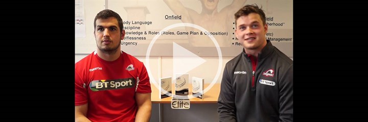 Two Edinburgh Rugby players sitting and facing the camera