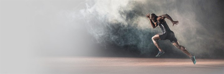 Man sprinting with smoke in background