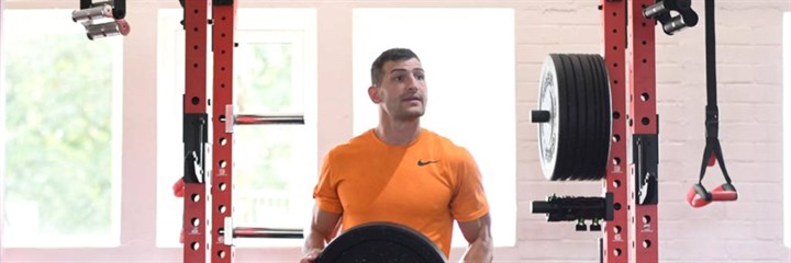 Jonny May holding a weight in the gym