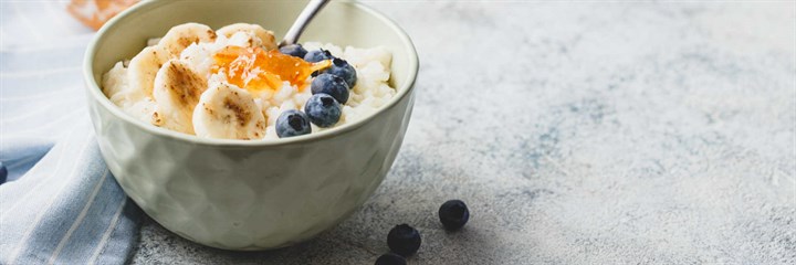 Bowl of porridge with blueberries and banana on top