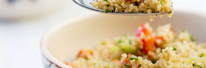 Photo of quinoa salad in a bowl with a fork