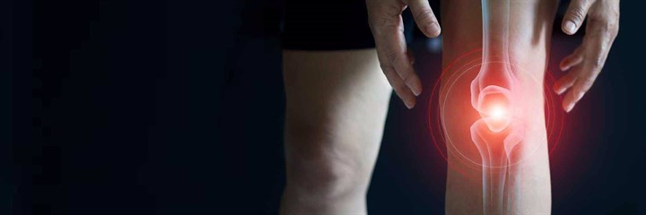 Image of knees with illustration of the joint glowing red